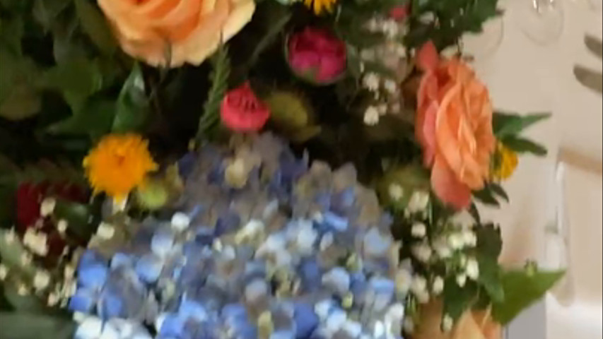 Blue hydrangea, rose and foliage top table display