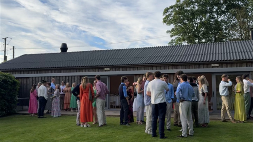 Guests on the lawn for the wedding party