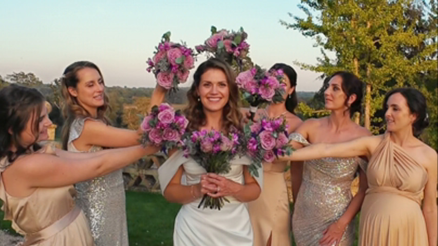 How to create a stunning bridal portrait with the bridesmaids' bouquets