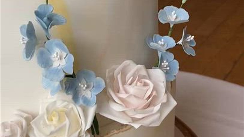 Four tier cake with sugar flowers