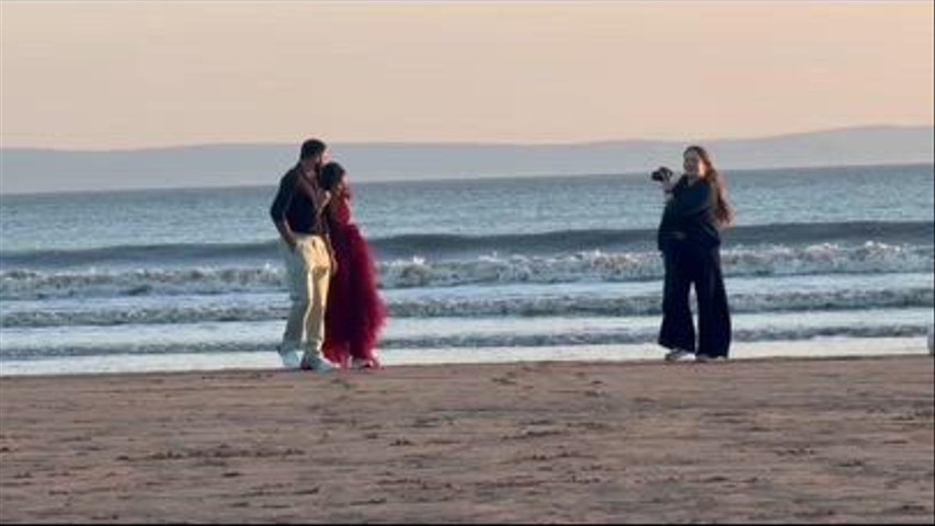Wedding photographer at work golden hour shoot