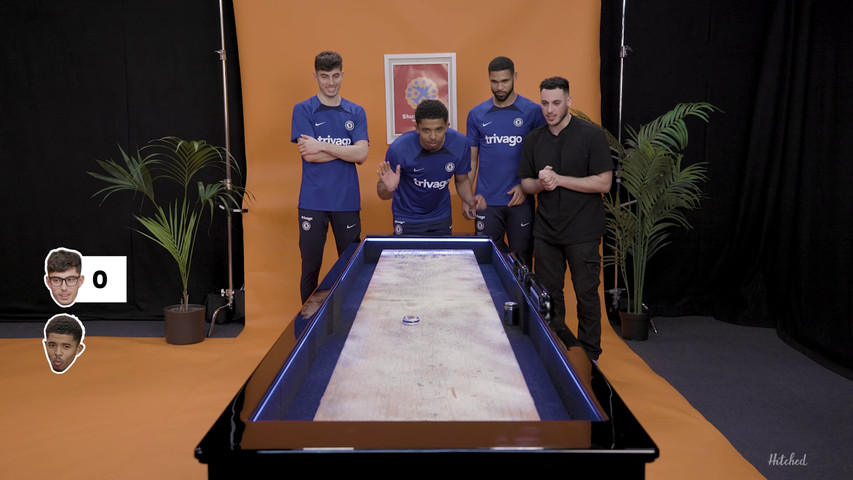 Chelsea FC players using the Table Shuffleboard