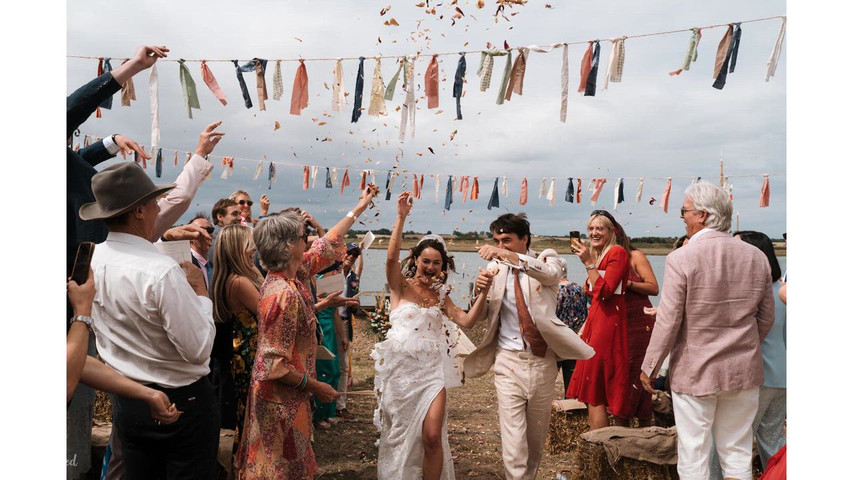 Joyful festival wedding on the Kent coast